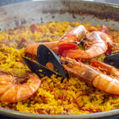 Valencian,Paella,With,Socarrat,Crust,Forming,In,A,Traditional,Steel